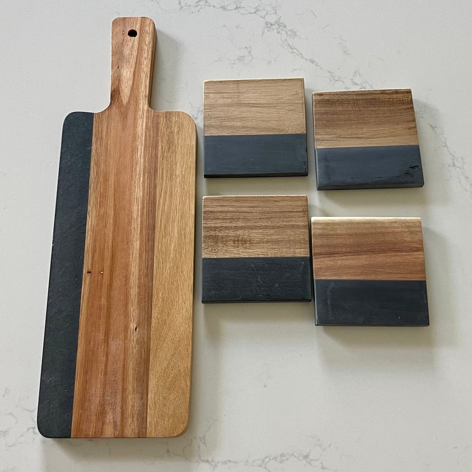 Includes acacia and slate charcuterie board and four slate and wood coasters.