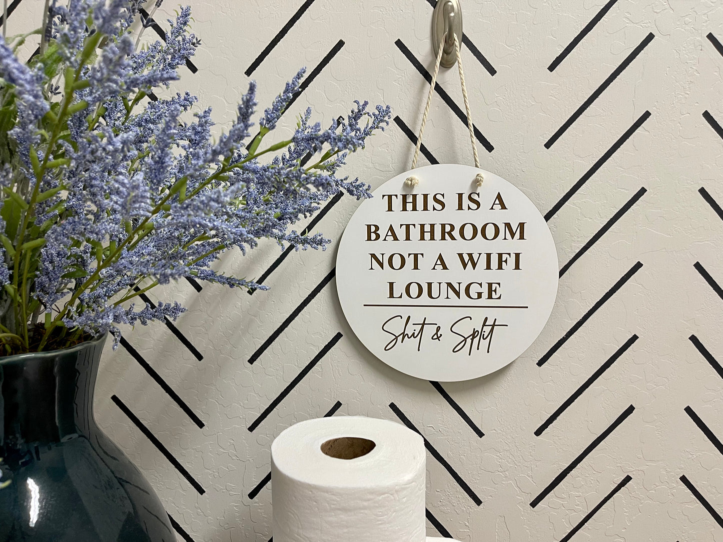 This bathroom is not a WiFi lounge. Shit & split